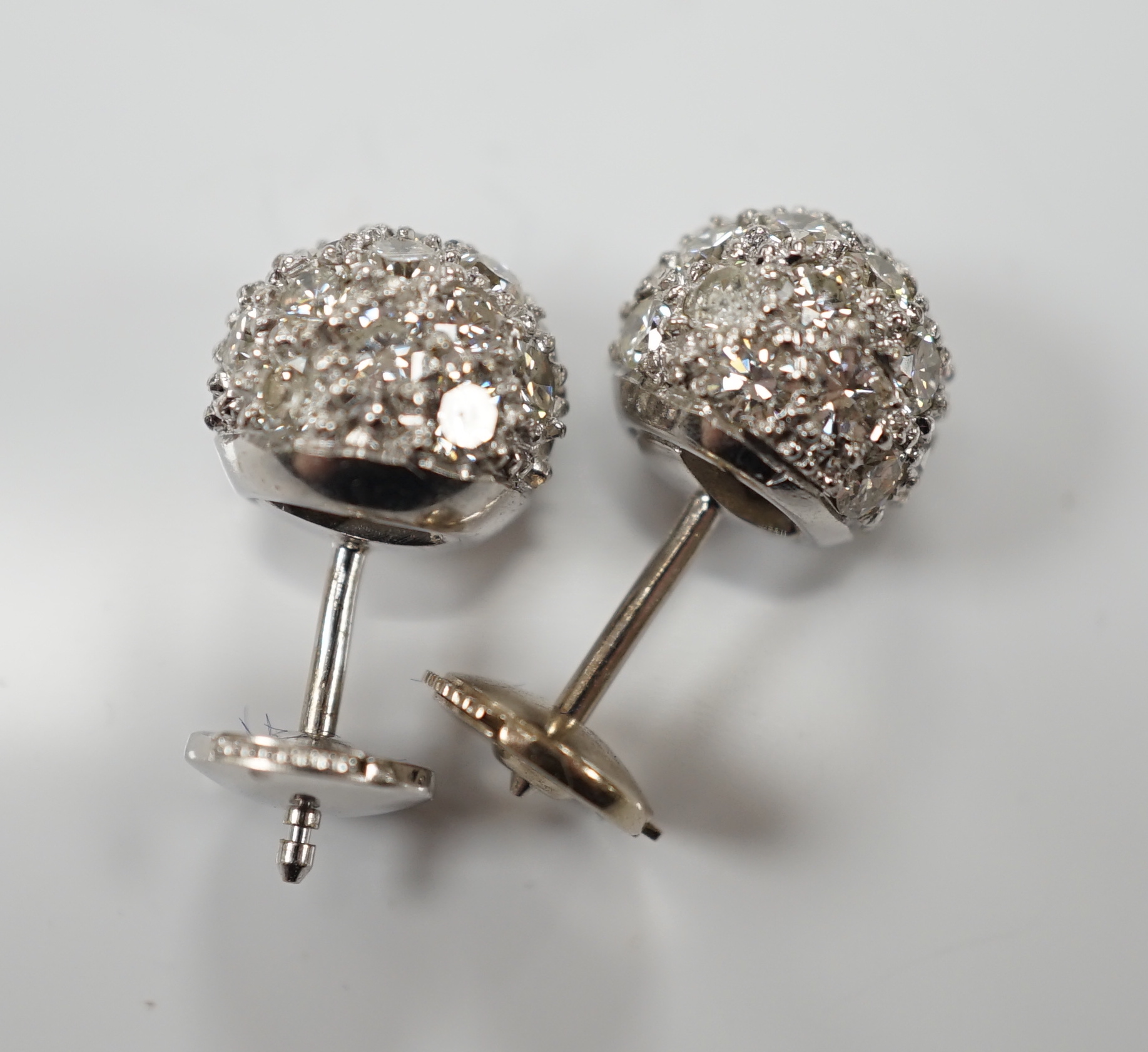 A modern pair of 18k white metal and pave set diamond spherical earrings, 9mm, gross 6.2 grams.